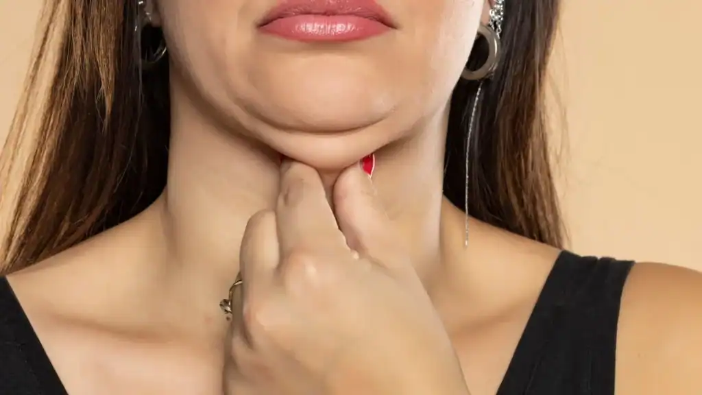 An image of a woman with double chin, sad, worried : Non Surgical Double Chin Removal Treatment in Rochford, UK