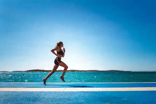Woman running showing strong leg muscle Rochford